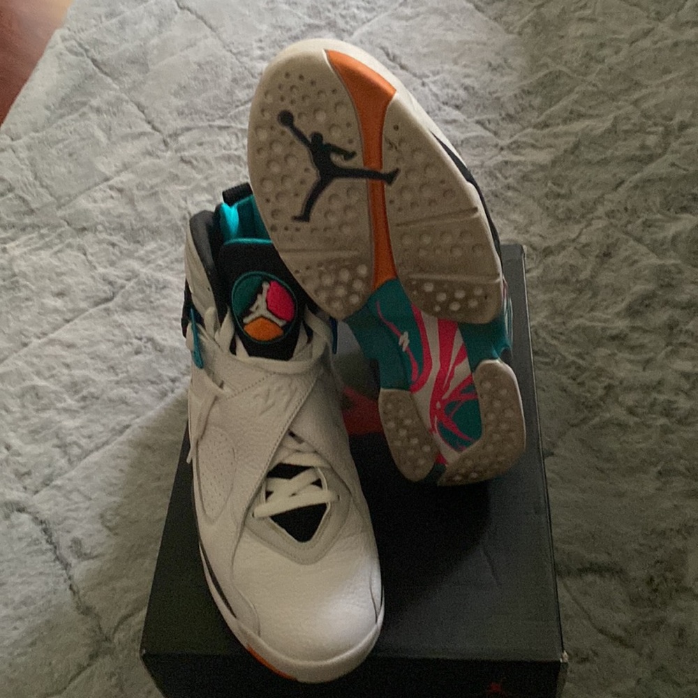 teal and white jordan 12s